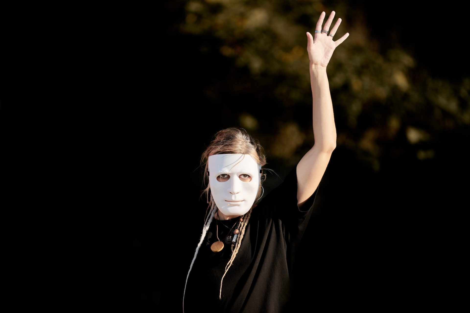 Woman acting in stage role in theater mask making smooth movements, stage role, theater performance